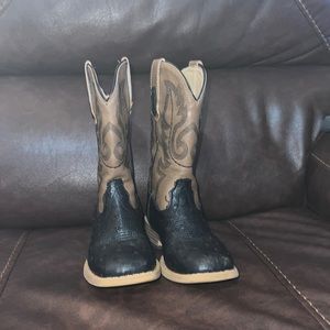 A brown and black roper boots